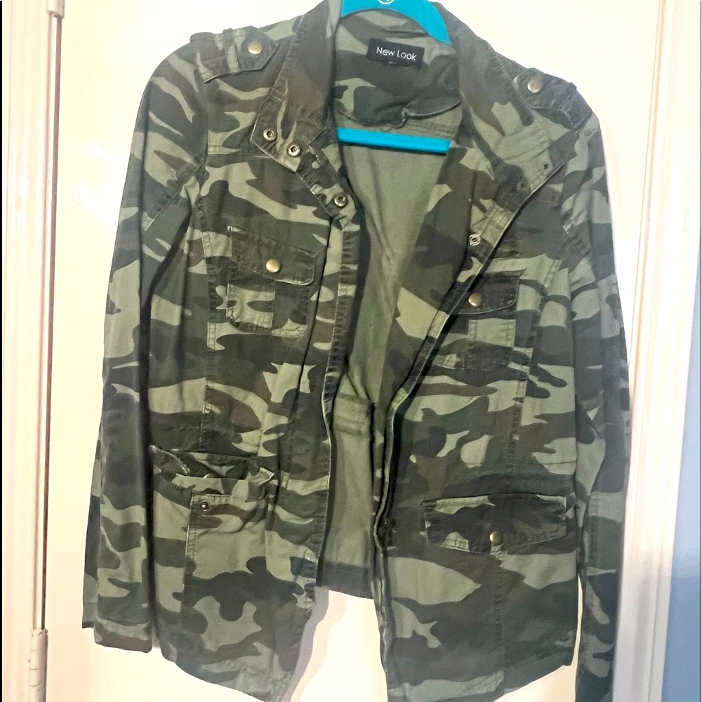 Slightly worn. Camo Light weight jacket